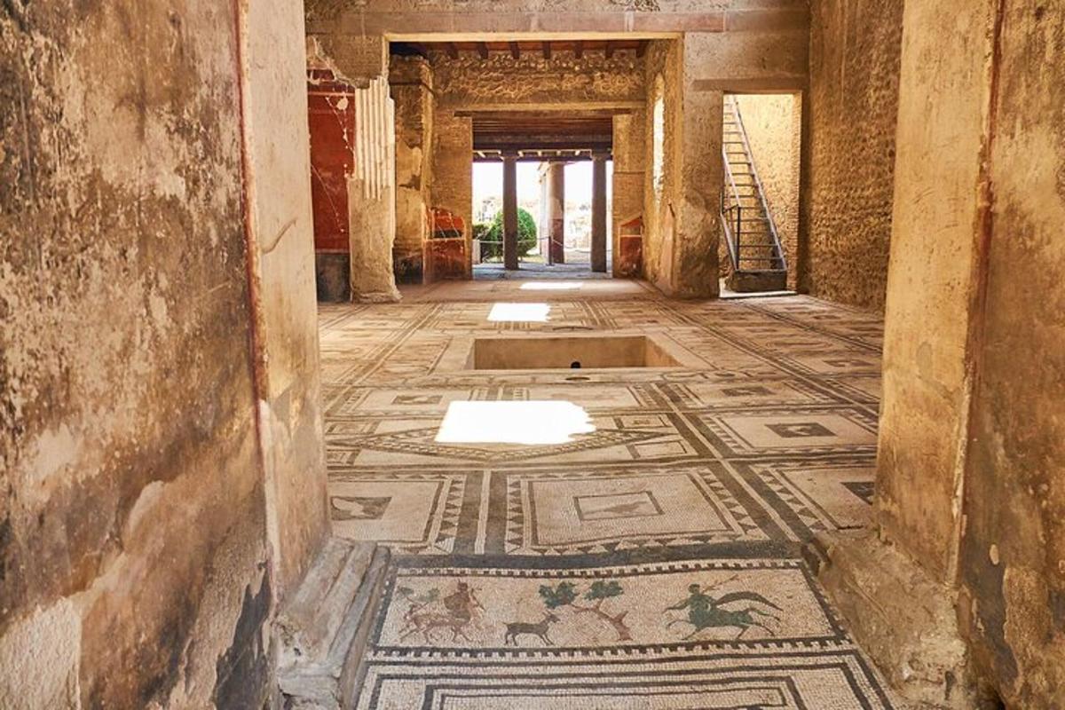a hallway with a mosaic floor in a building