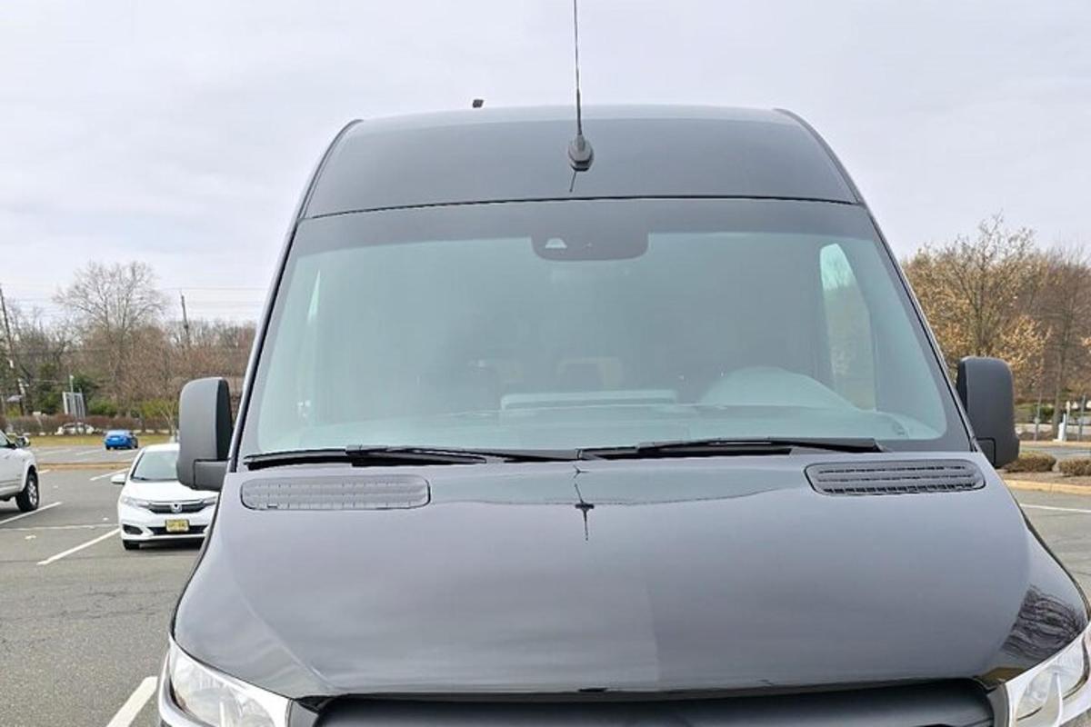 a white van is parked in a parking lot