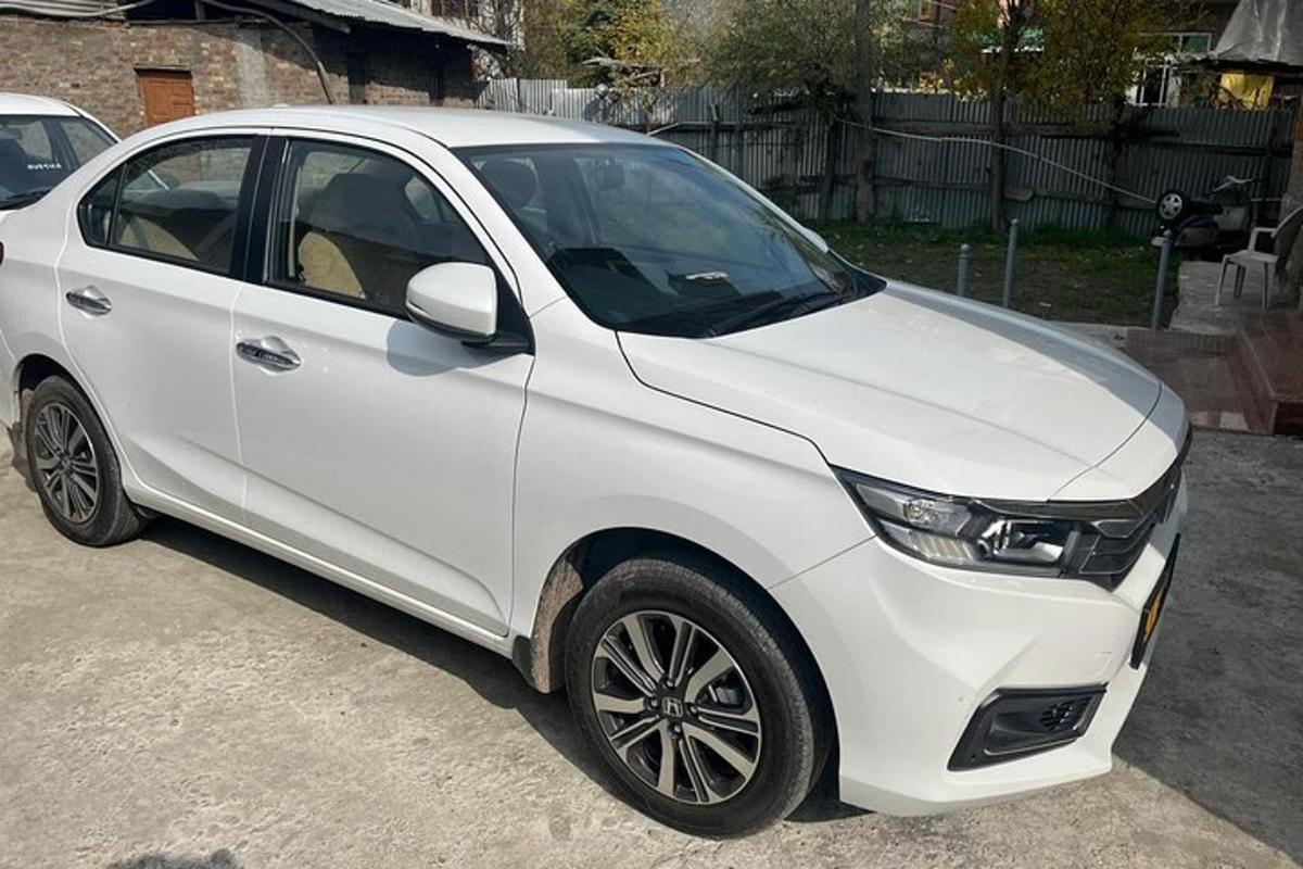 a white car parked in a parking lot