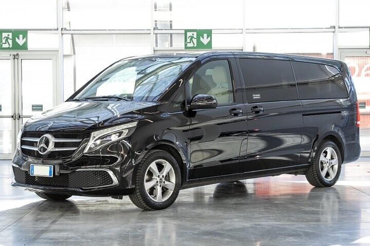 a black van is parked in a garage