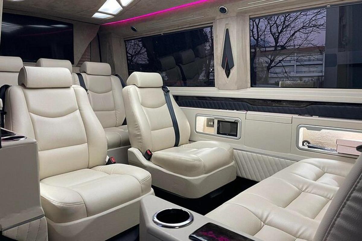 an interior of a limousine with white seats