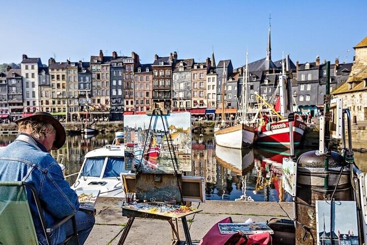 a man painting a picture of a harbor with boats