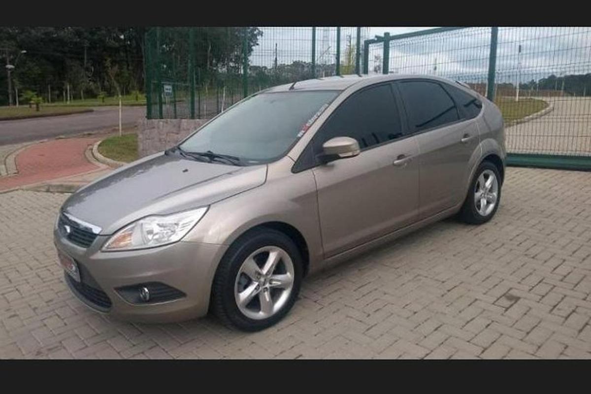 a silver car parked in a parking lot
