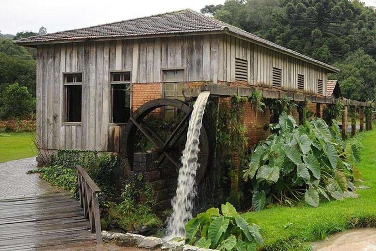 a building with a water fountain next to a house