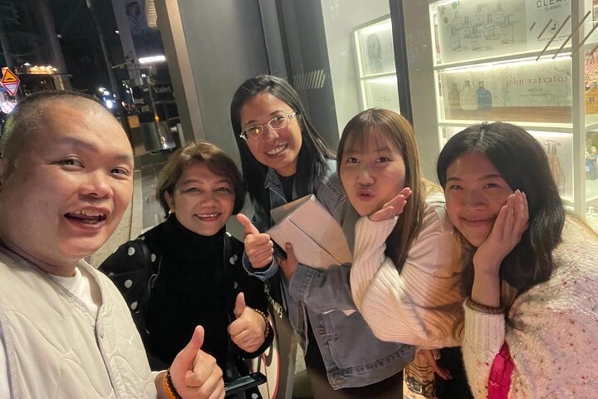 a group of women giving the thumbs up sign