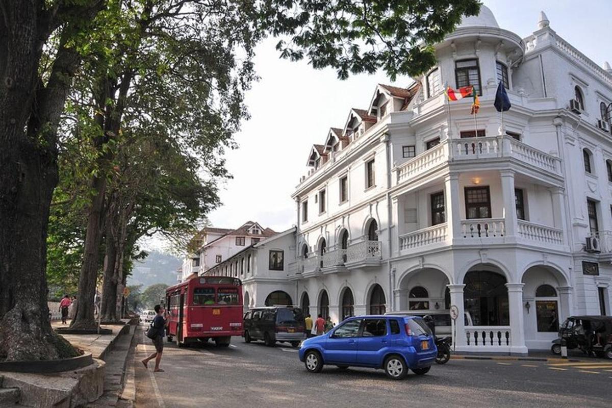 a blue car parked in front of a white building