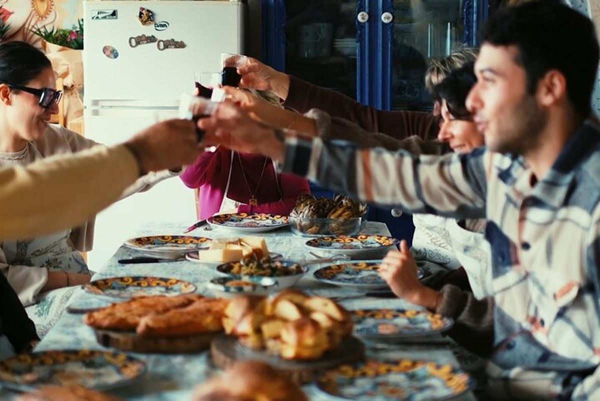 a group of people sitting around a table with food