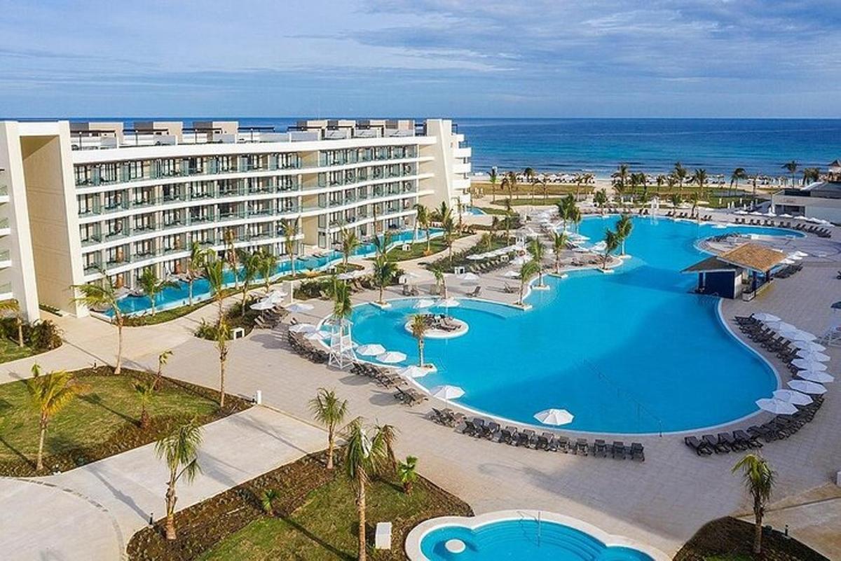 an aerial view of a resort with a large swimming pool