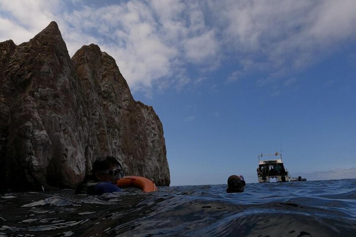 a man laying on a raft in the water