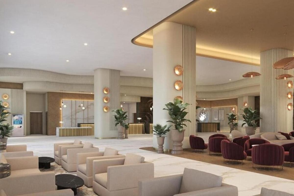 a lobby with couches and chairs in a building
