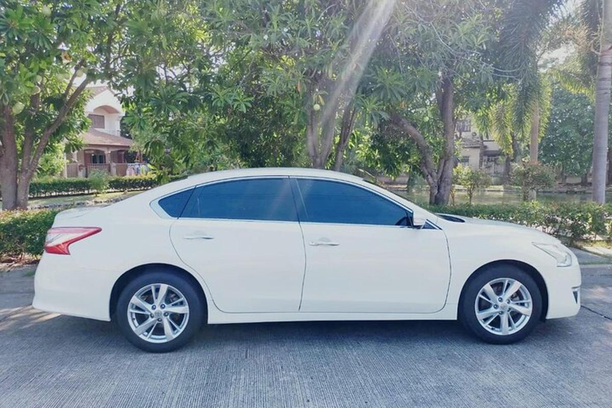 a white car parked in a parking lot