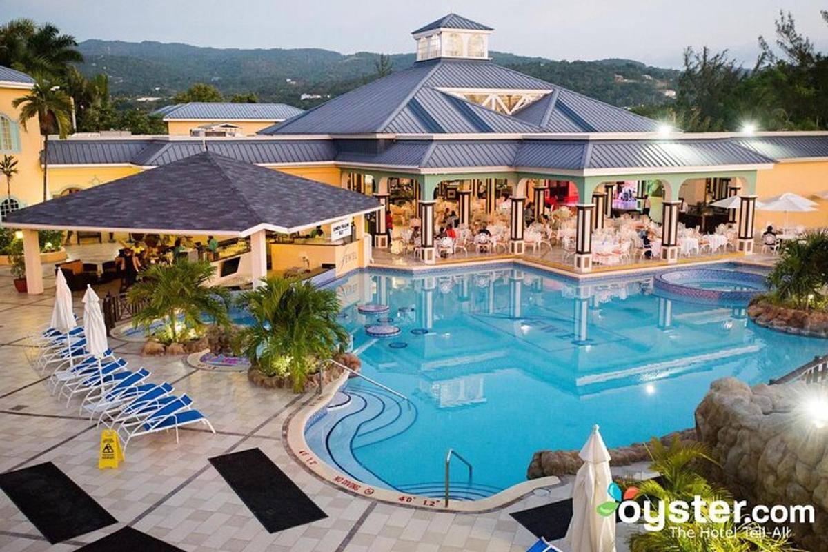 a large swimming pool in front of a resort