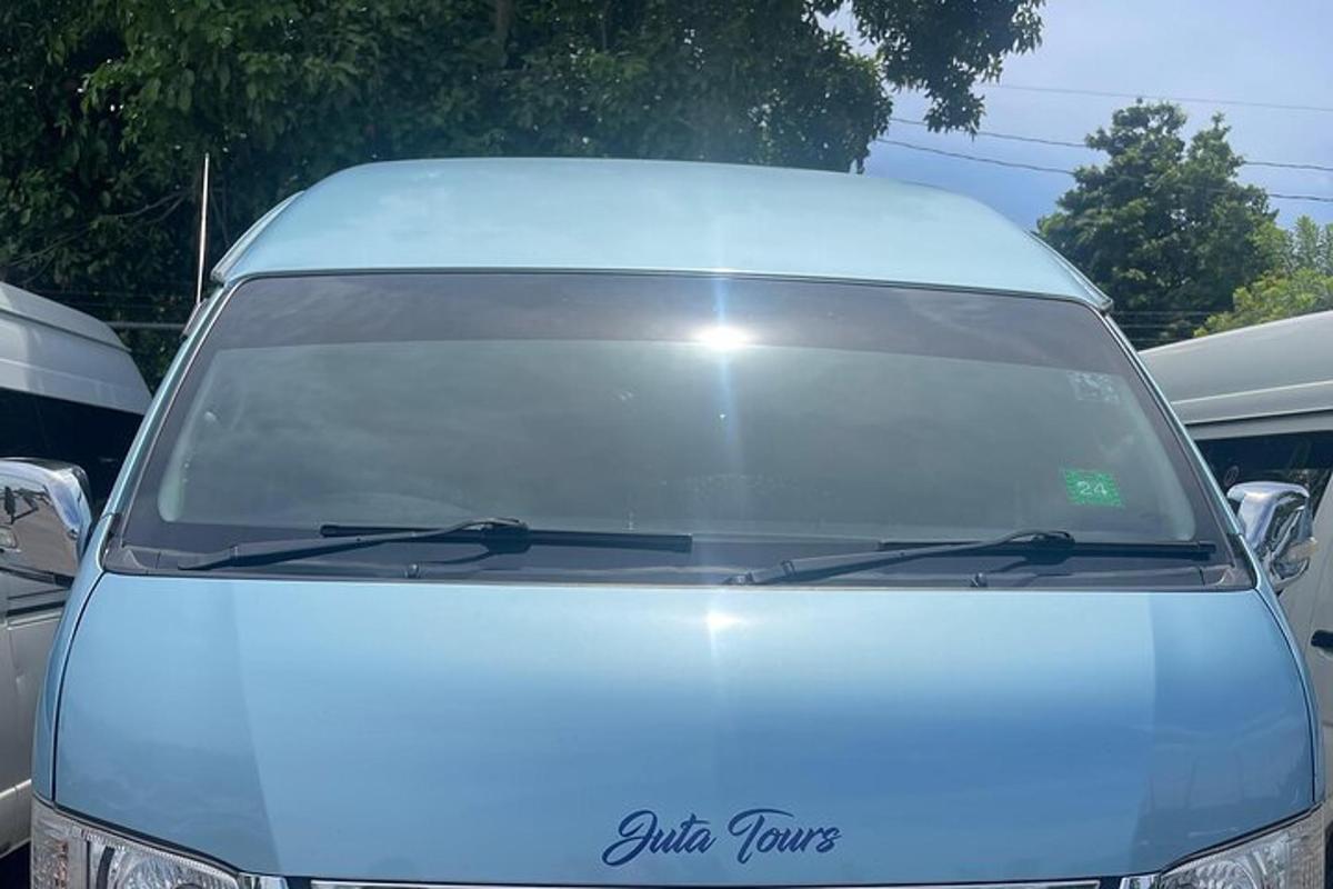 a front windshield of a white car in a parking lot