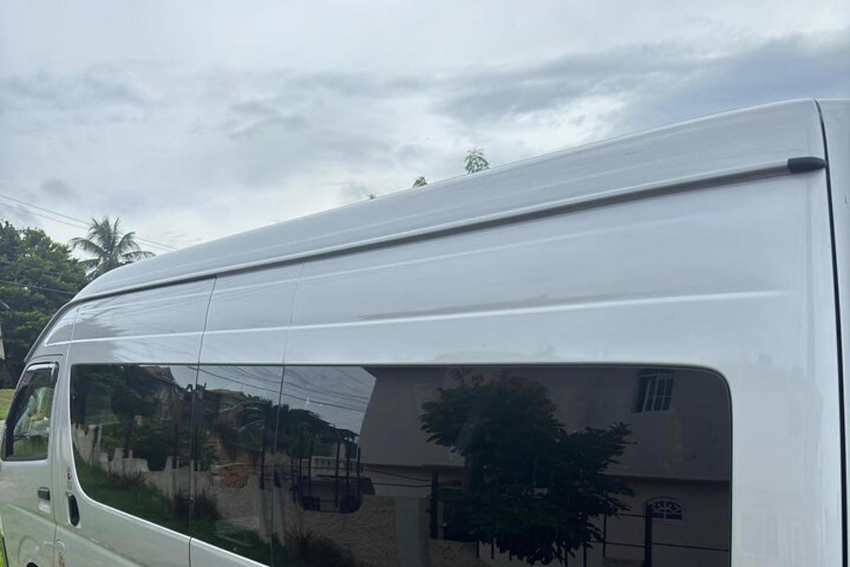 a white van parked in front of a building