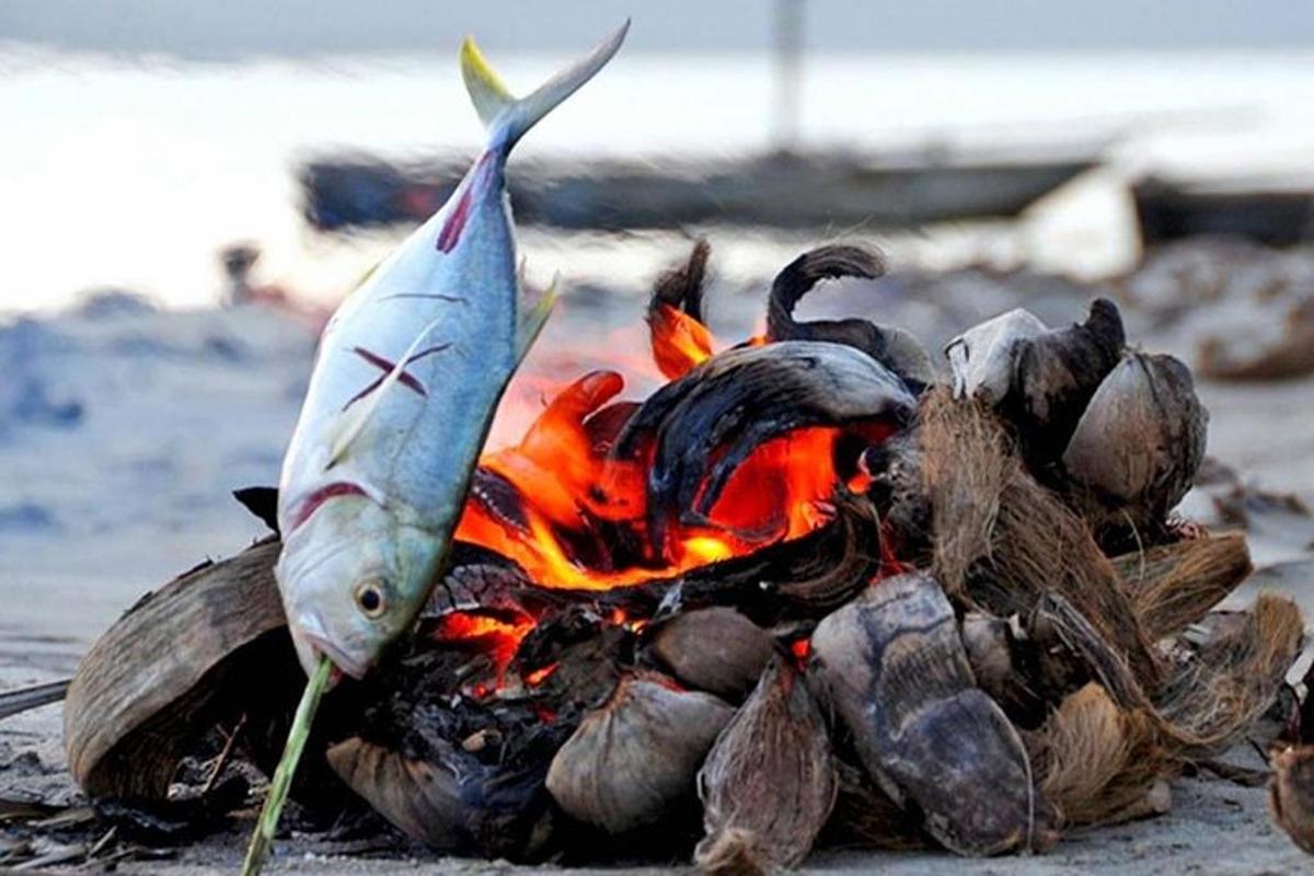 a fish is standing on top of a fire