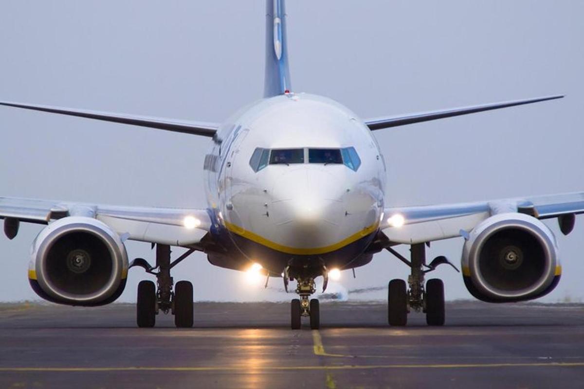 an airplane sitting on the runway at an airport