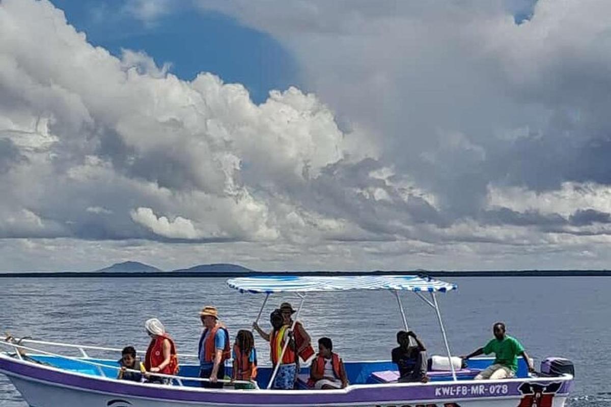 a group of people on a boat in the water
