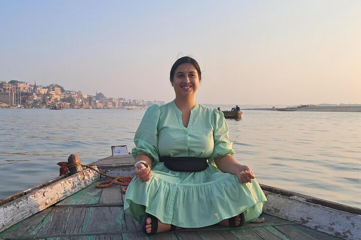 a woman sitting on a boat in the water