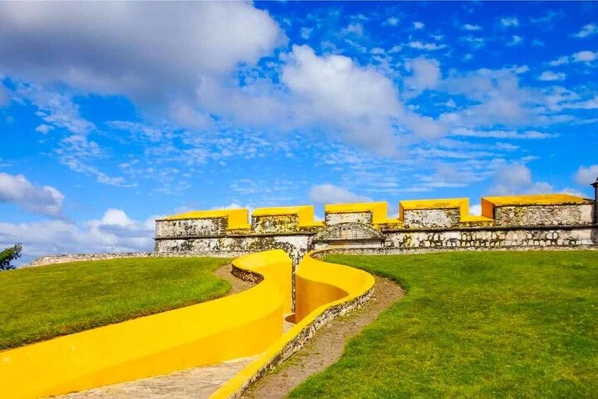 a yellow bench in front of a building