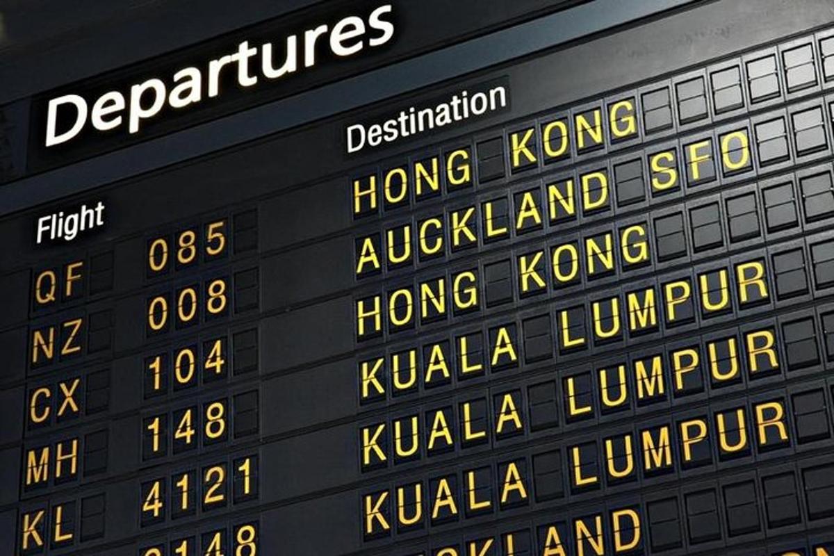 a close up of a scoreboard with the names of trains