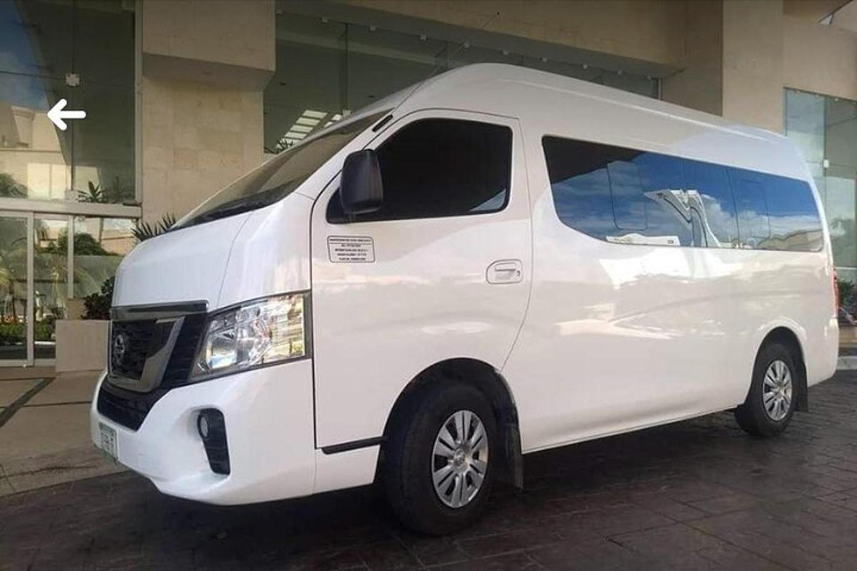 a white van parked in front of a building
