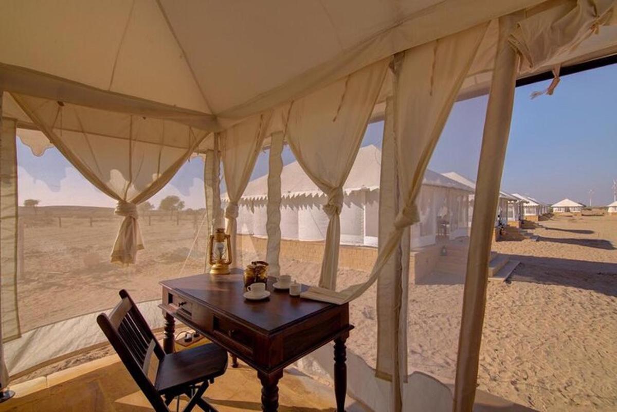 a desk in a tent in the desert