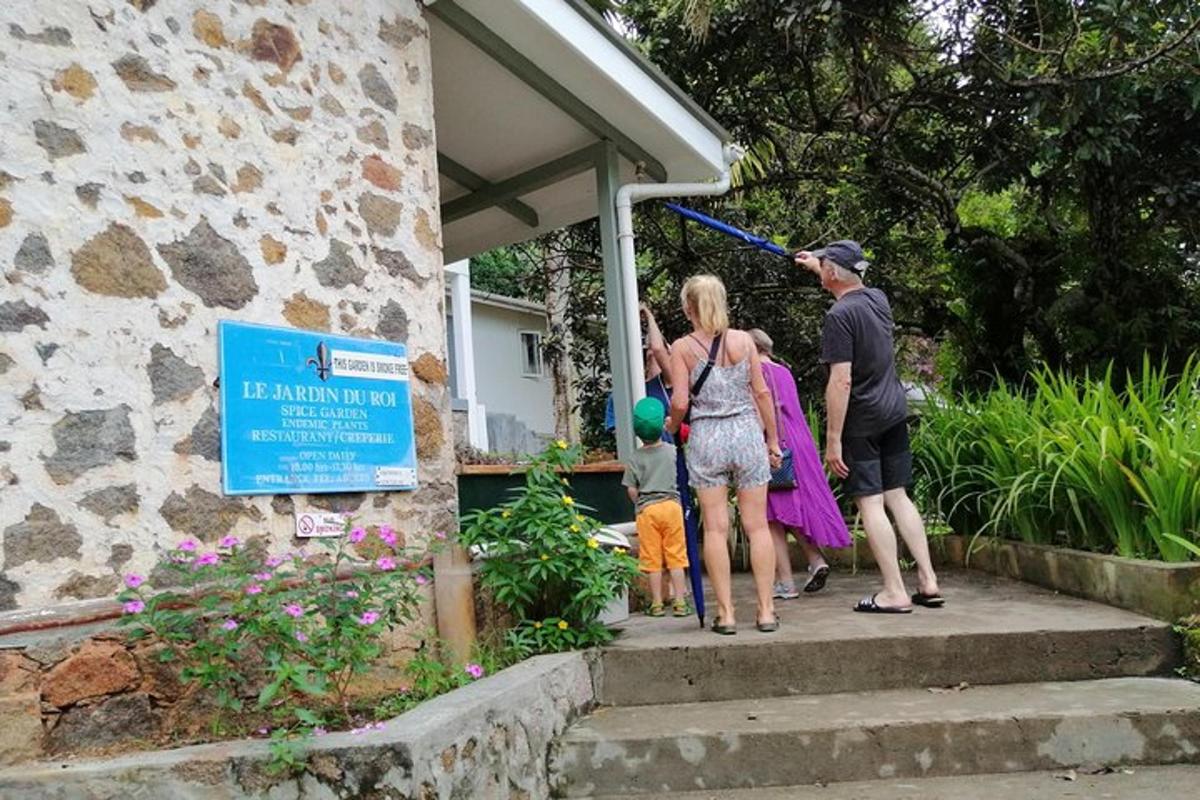 a group of people standing on steps outside a house