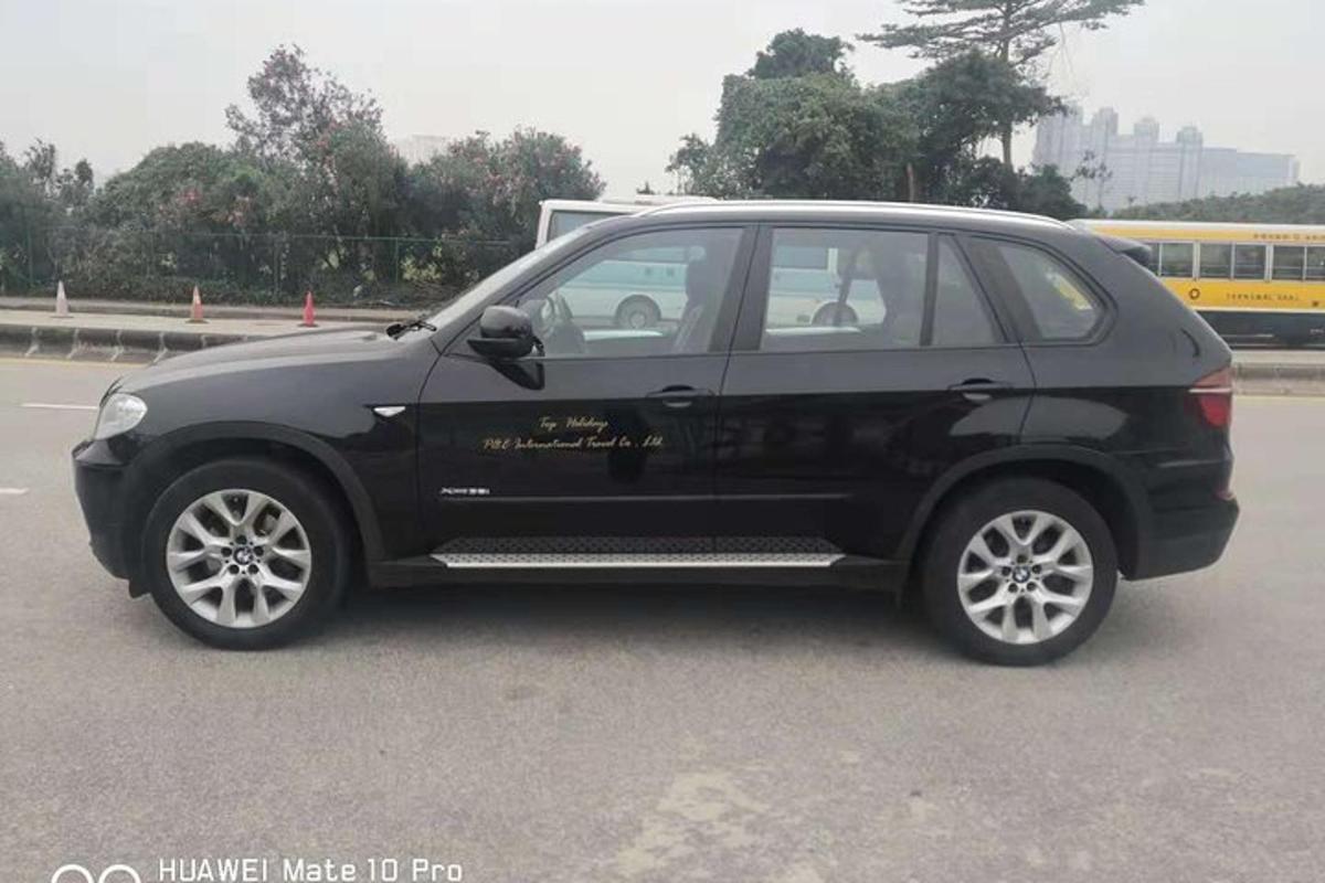a black car parked in a parking lot