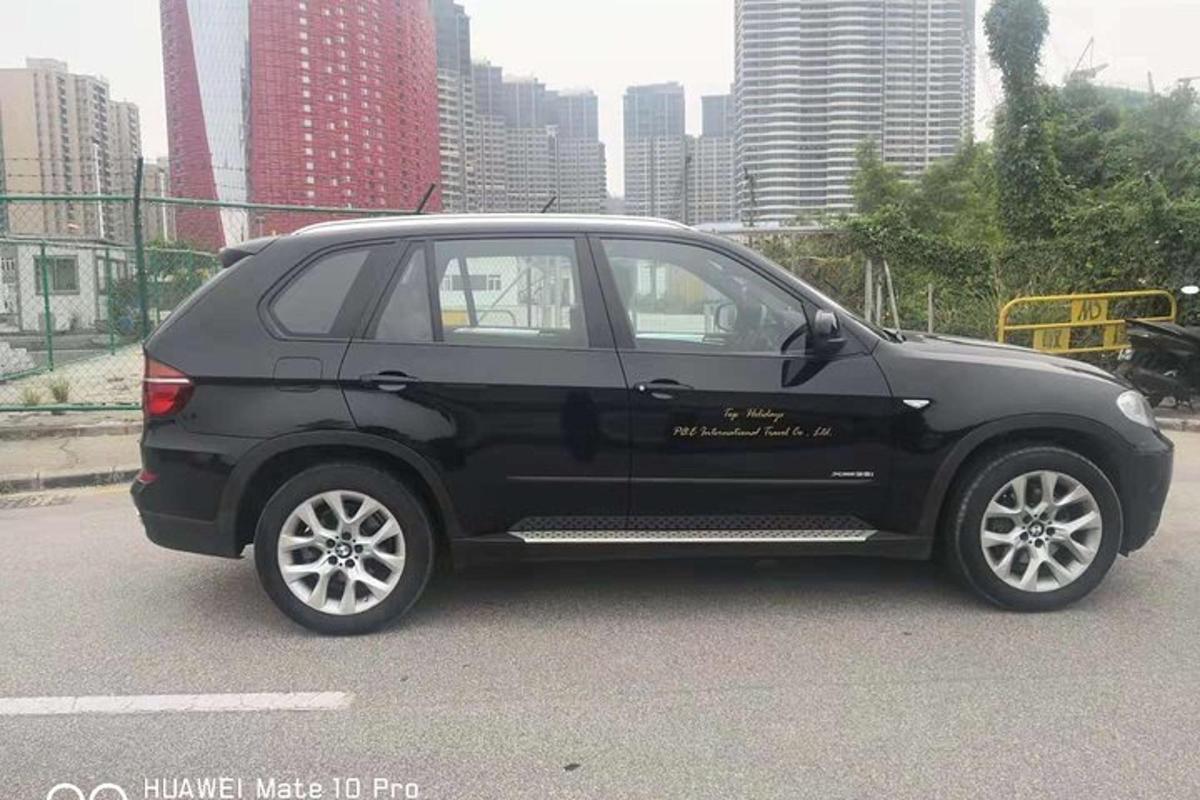 a black car parked in a parking lot