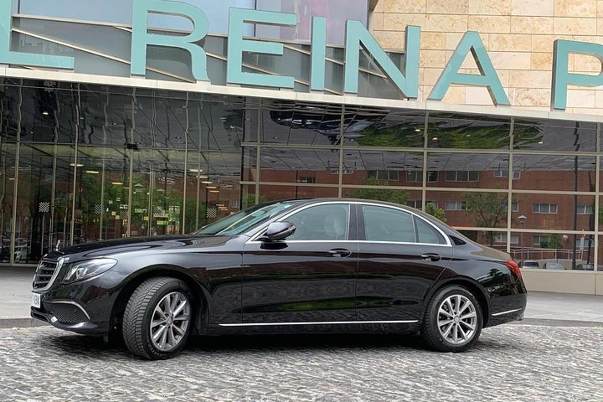 a black car parked in front of a building