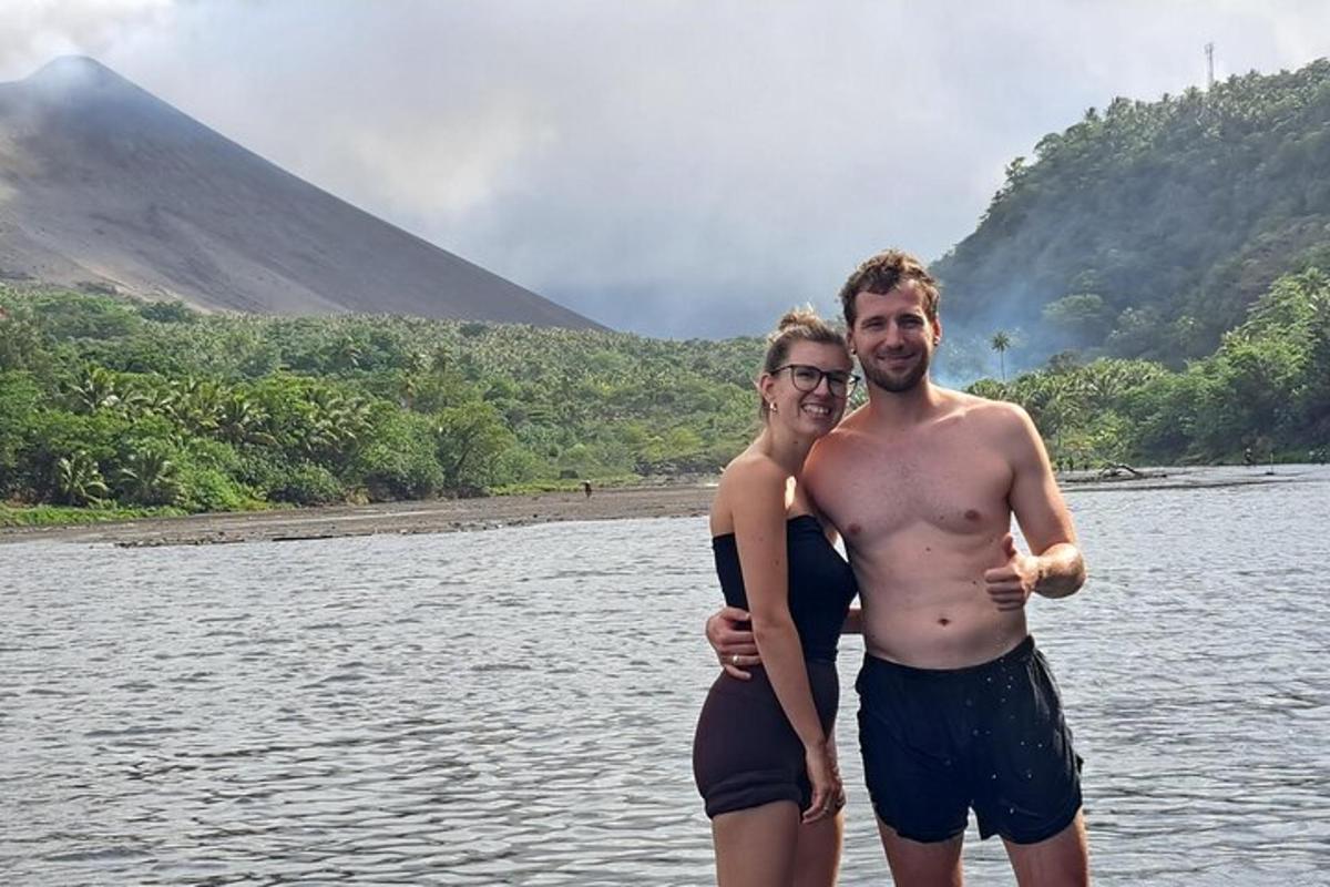 a man and a woman standing in the water