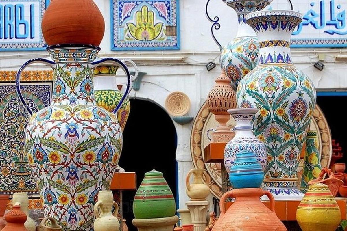 a group of colorful vases on display in a store