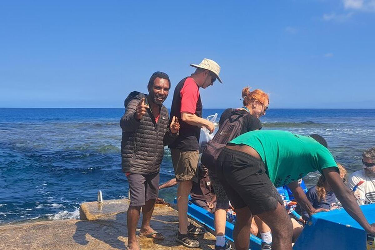 a group of people on a boat on the beach