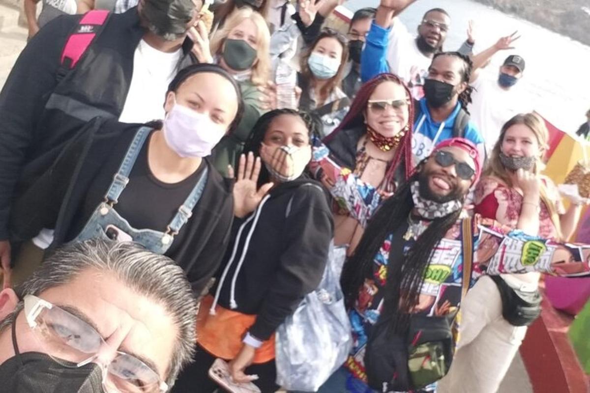 a group of people wearing masks standing together