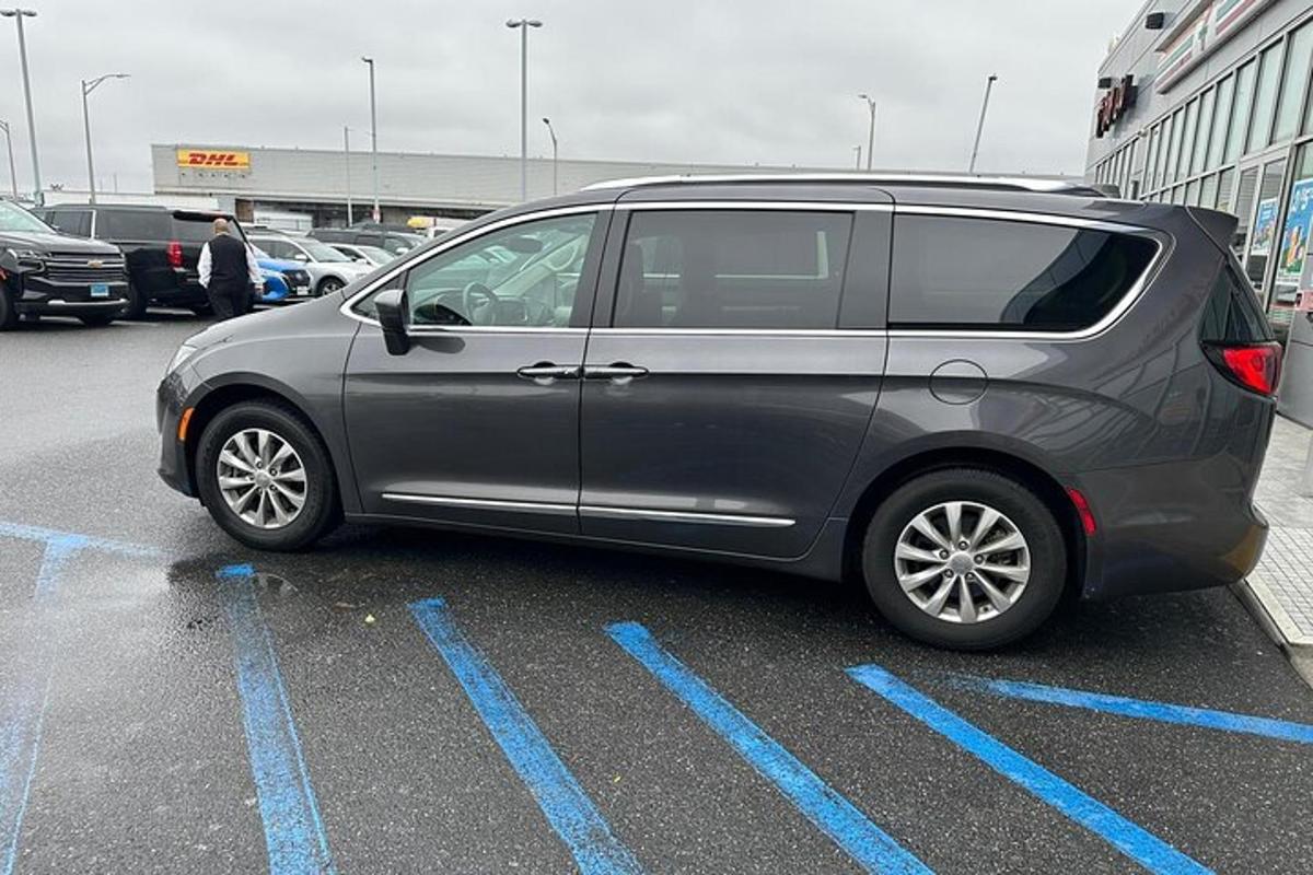 a gray van parked in a parking lot