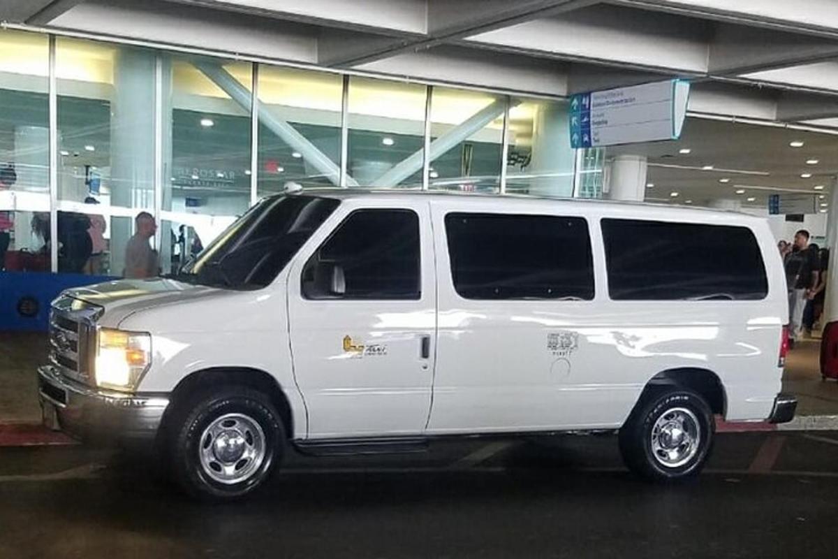 a white van parked in front of a building