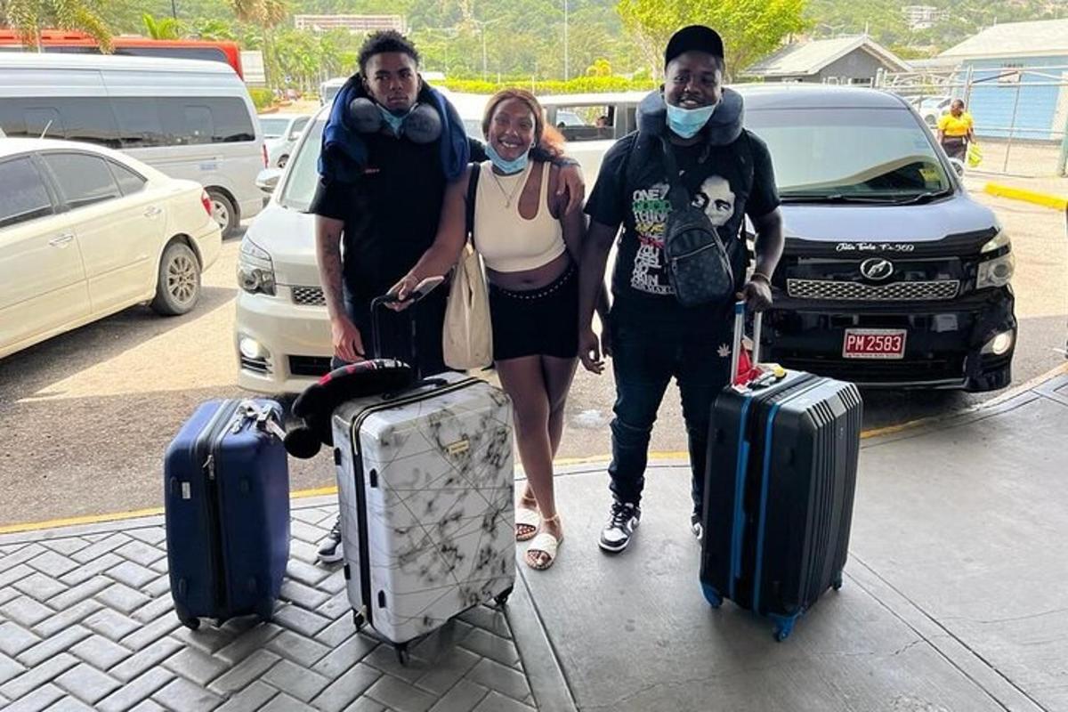 a group of three people standing with their luggage