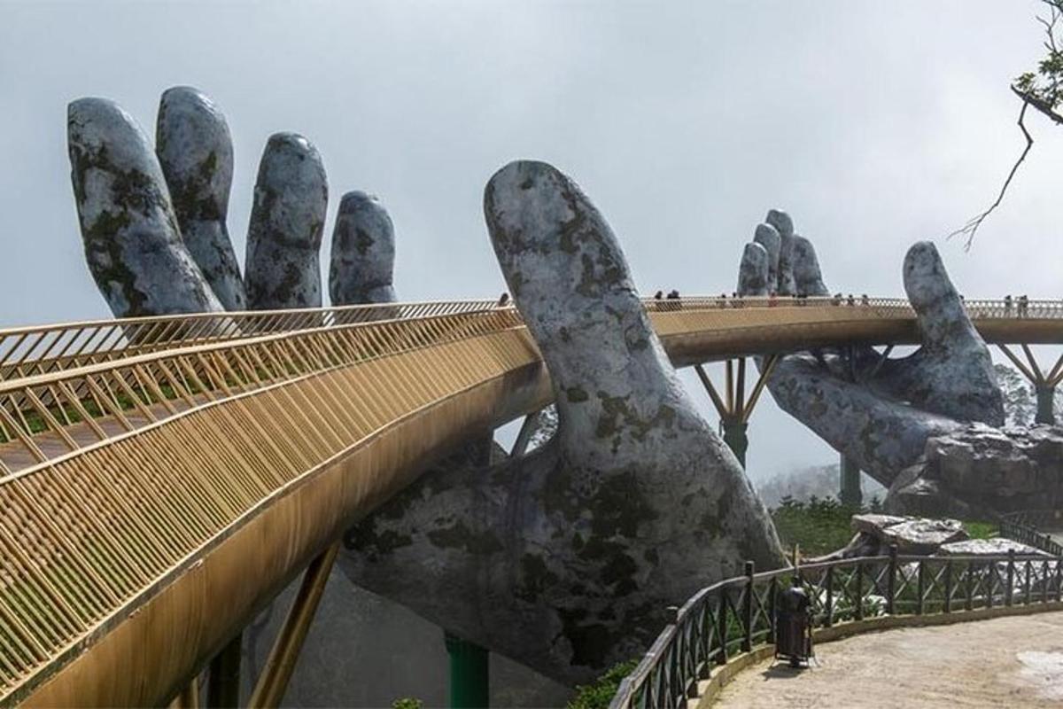 a bridge with a large hand holding up a bridge