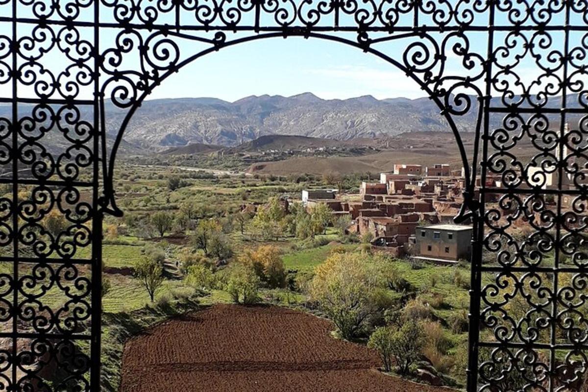 an open gate with a view of a city