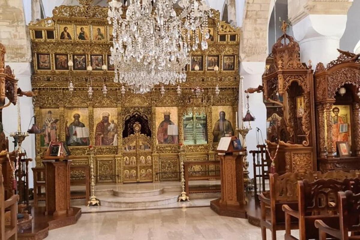 an altar in a church with a chandelier