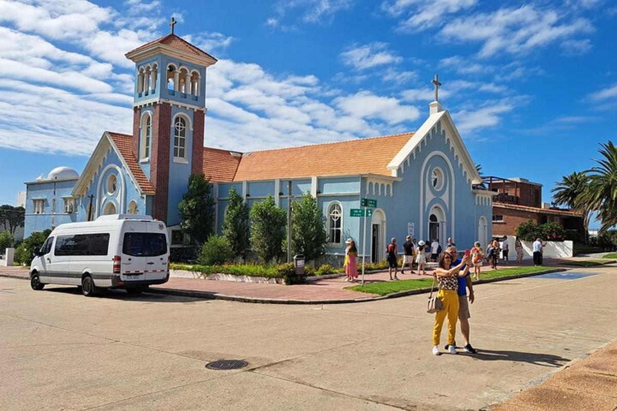a group of people standing in front of a church