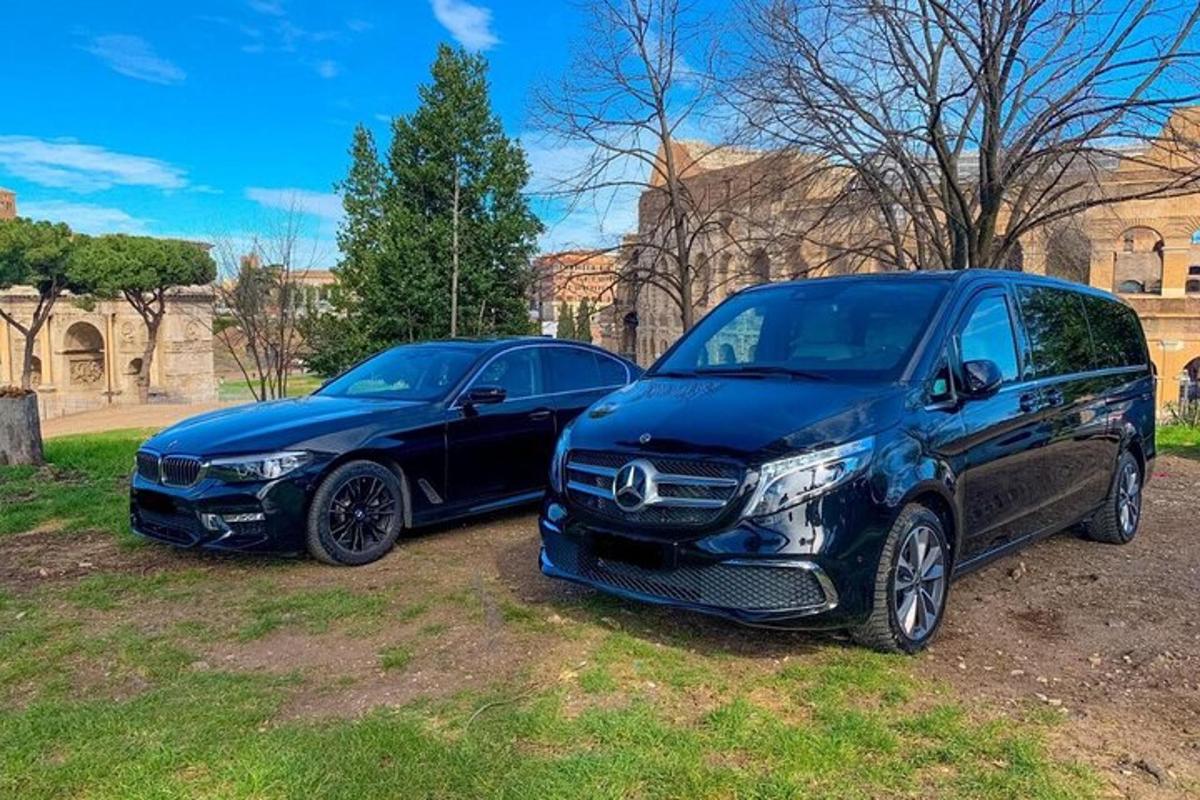two cars parked next to each other in a field