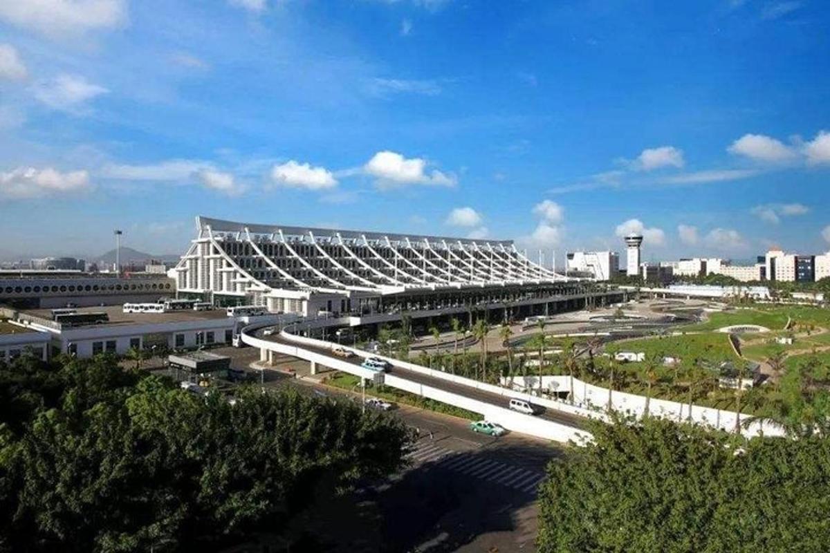 a large building with a highway in front of a city