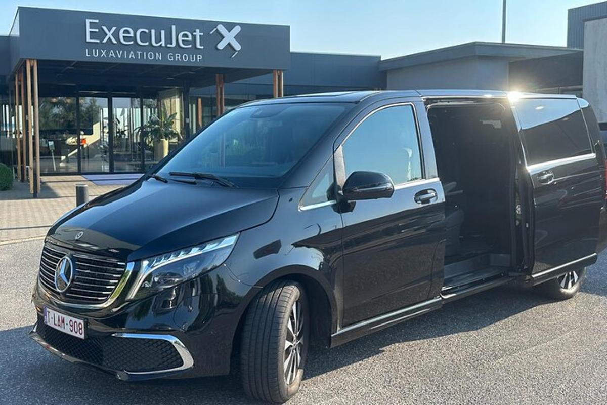 a black van parked in front of a building
