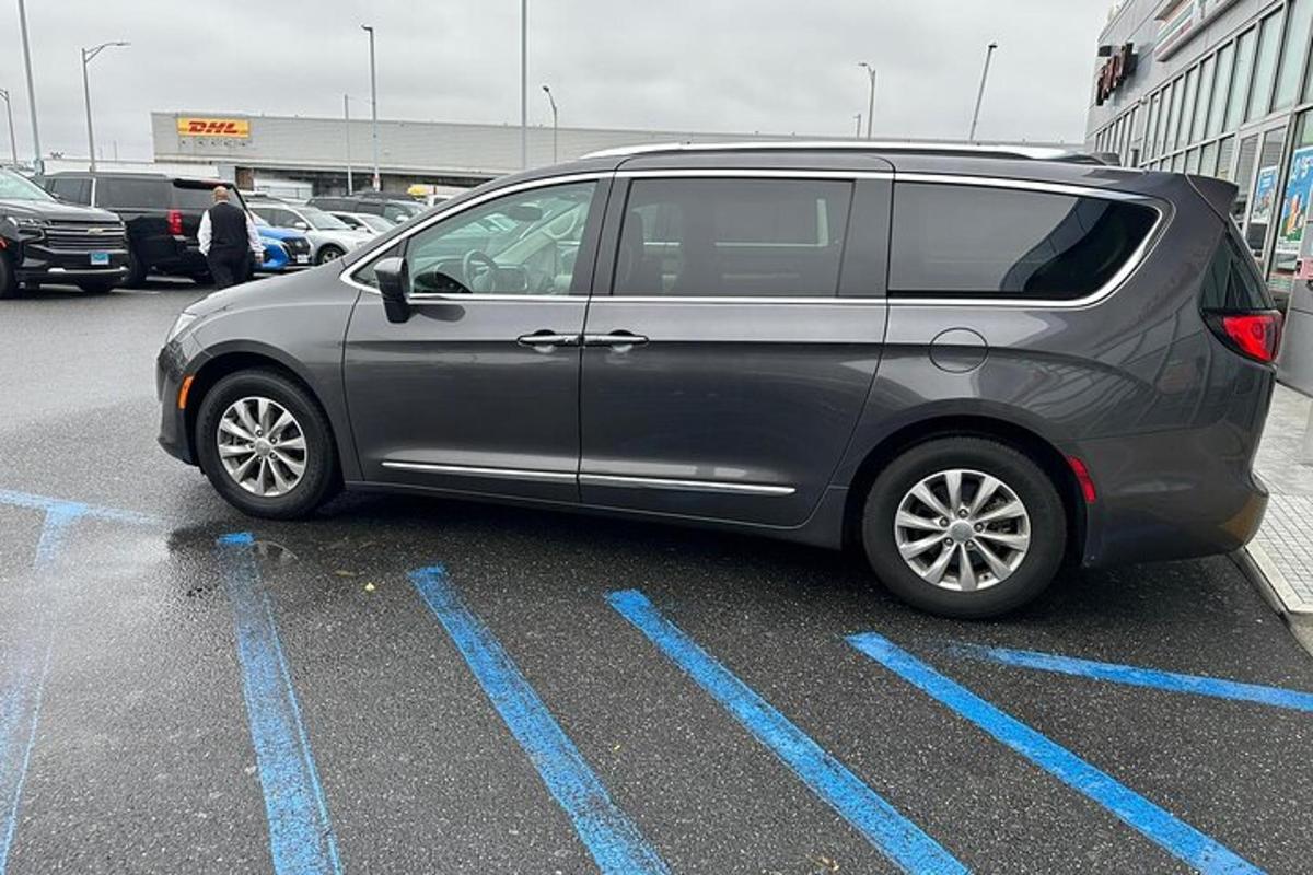 a silver van parked in a parking lot