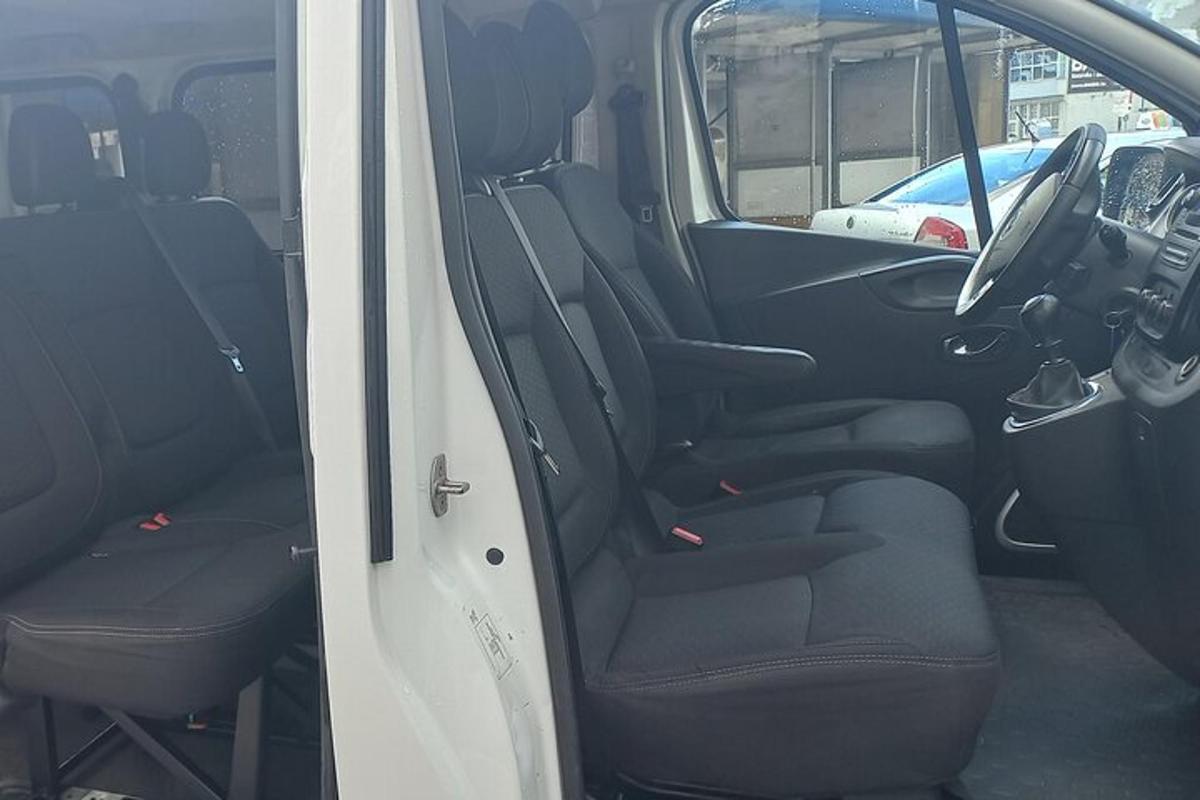 a back seat of a van with the door open