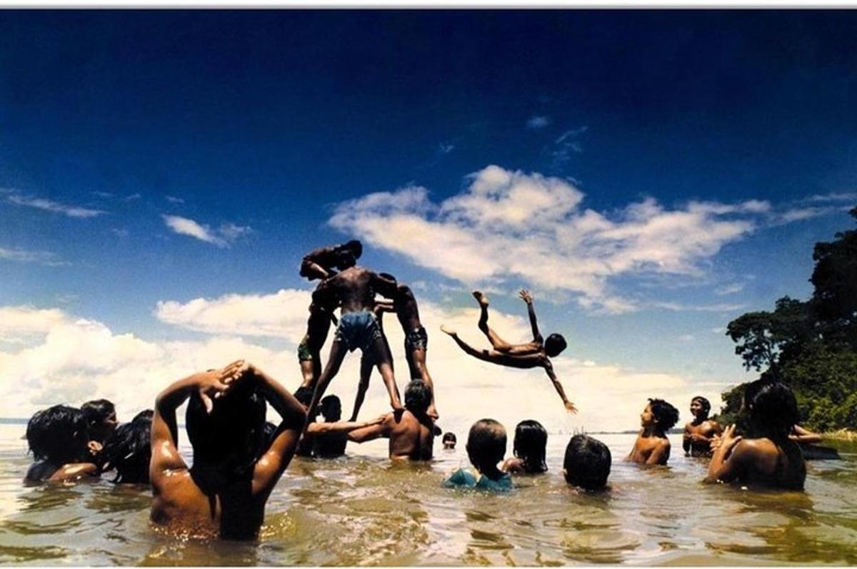 a group of people standing in the water