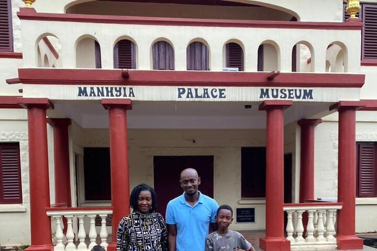 a group of three people standing in front of a building