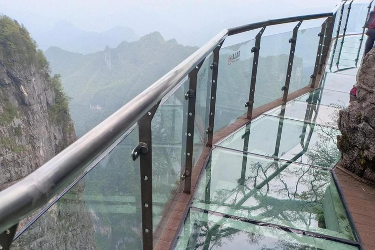 a glass walkway on the edge of a glass floor