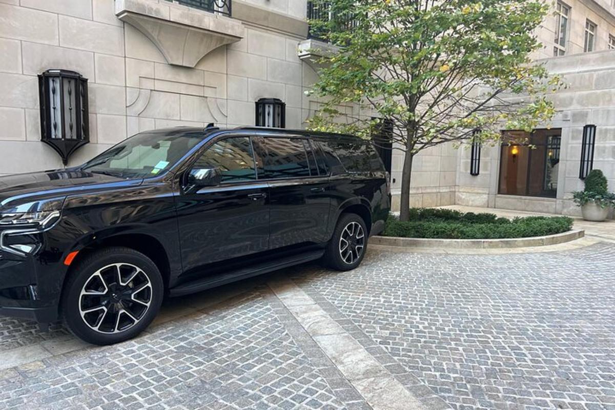 a black car parked in front of a building
